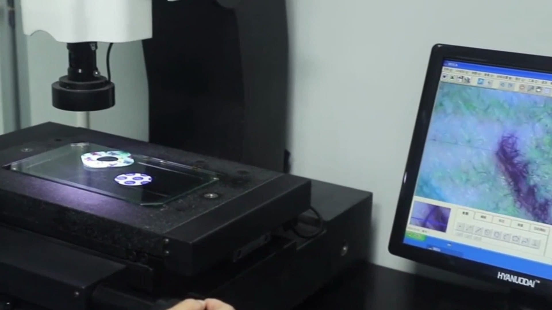 Macro shot of skin-friendly medical adhesive being carefully tested in a laboratory setting